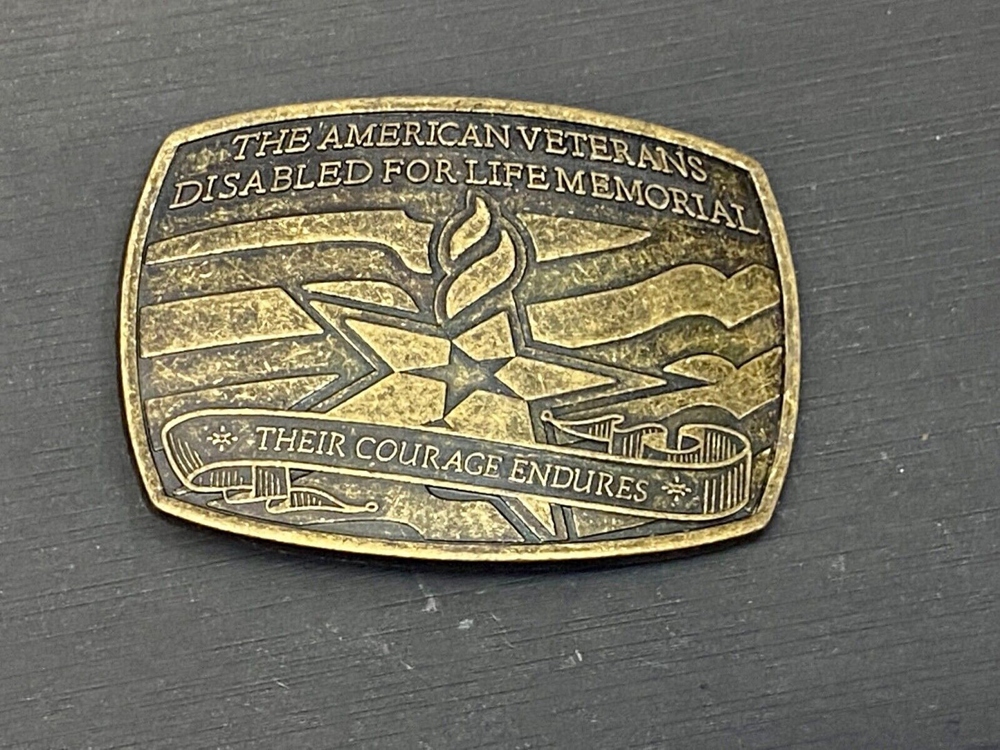 The American Disable Veteran Memorial Belt Buckle Their Courage Endures.