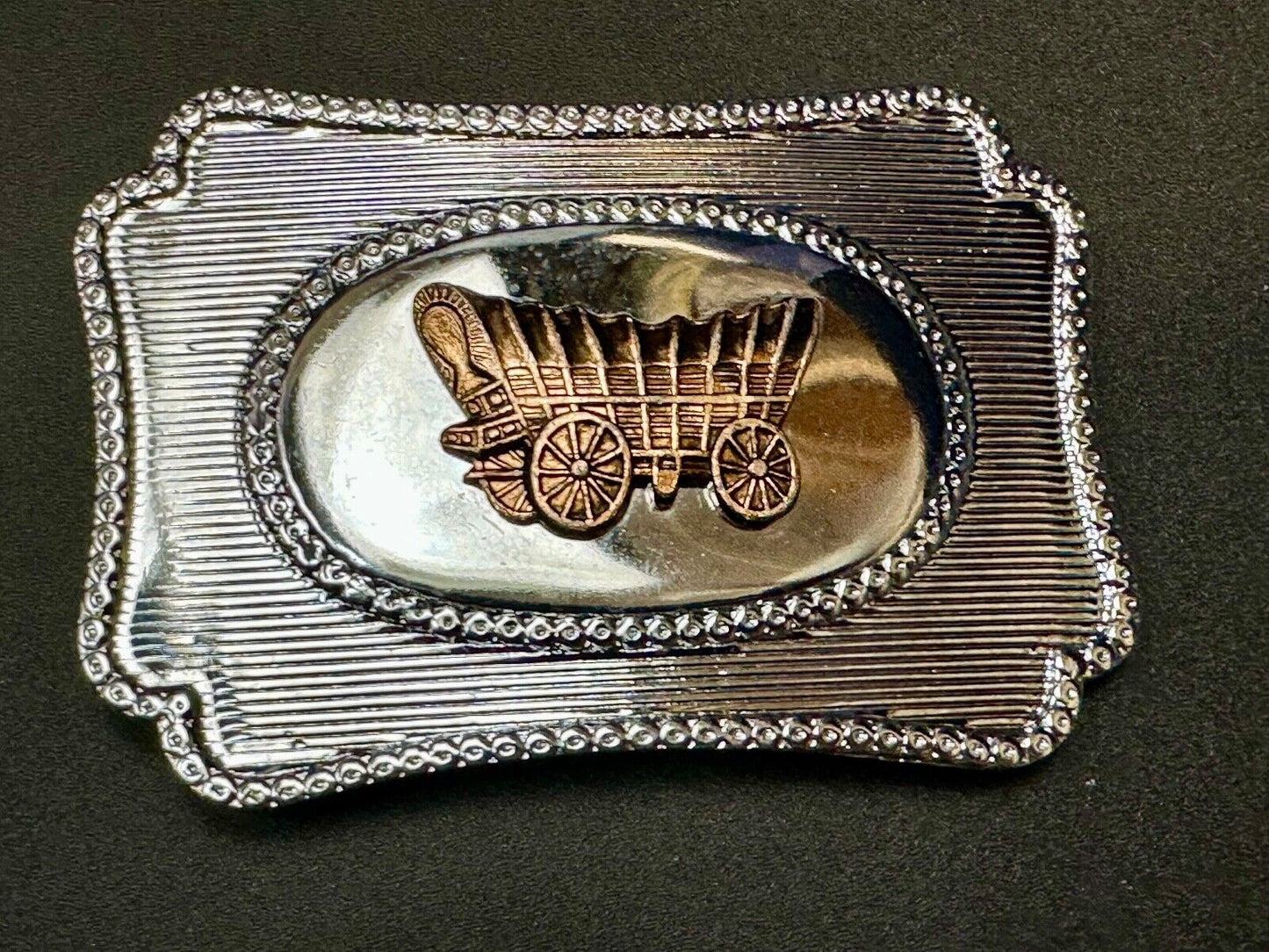 Vintage covered wagon western horse drawn transportation belt buckle