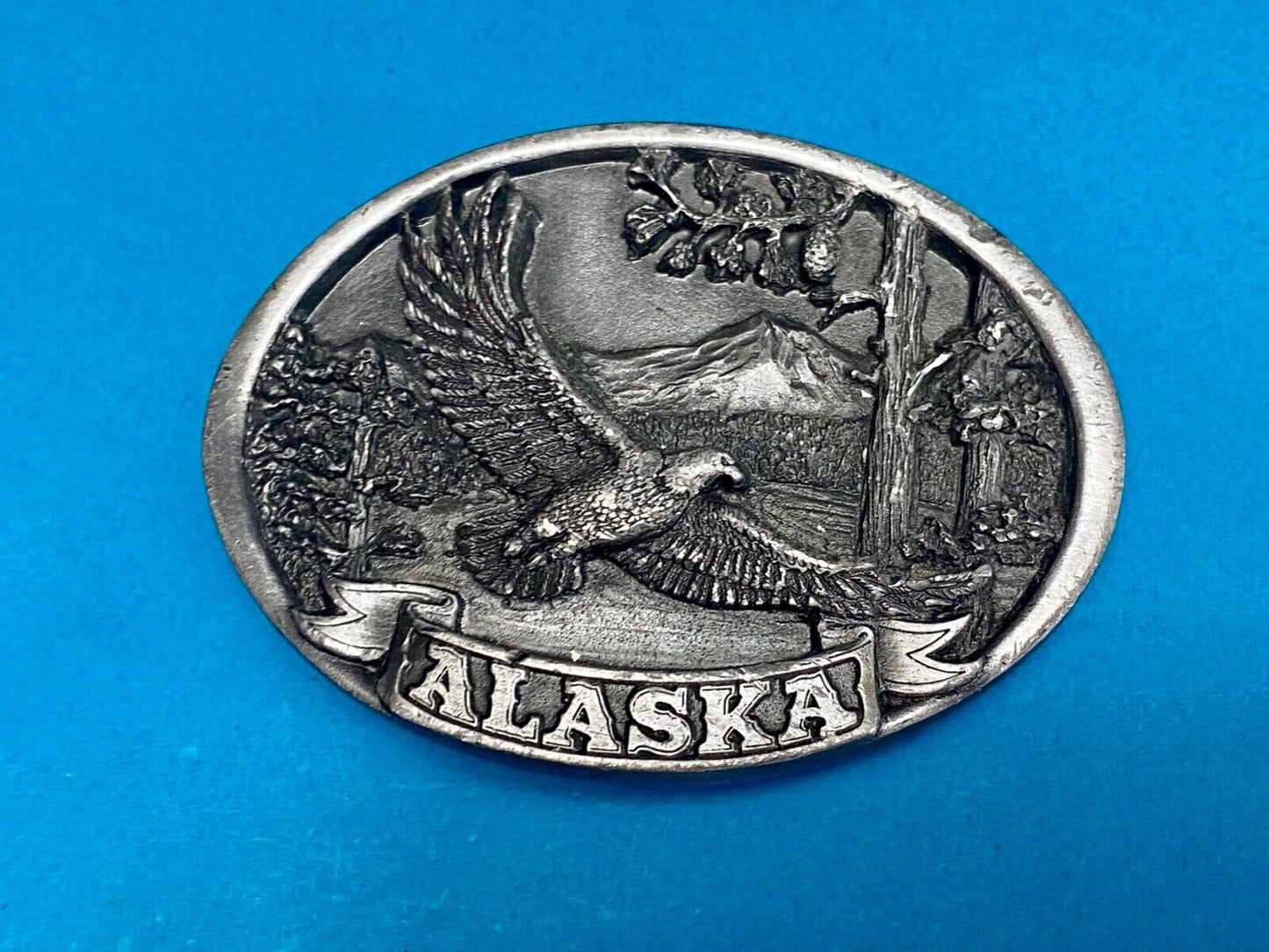Vintage 1986 Eagle flying high over mountains Alaska belt buckle by C+-J