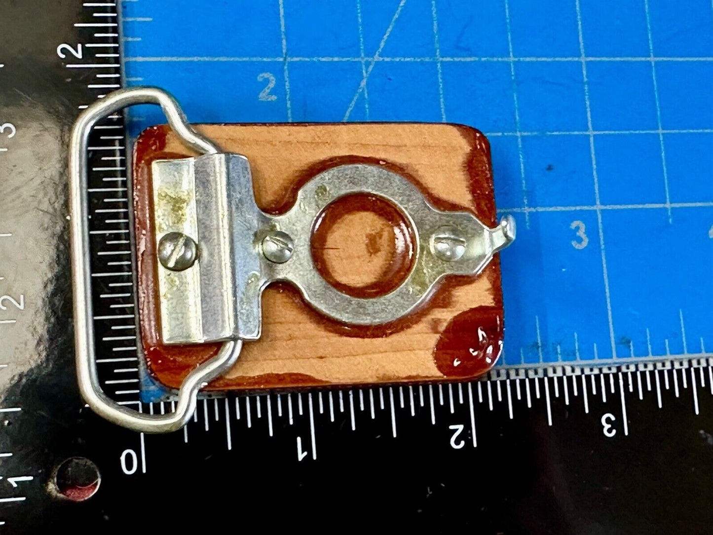Artisan wood belt buckle with inlaid Luary Caverns cave token coin