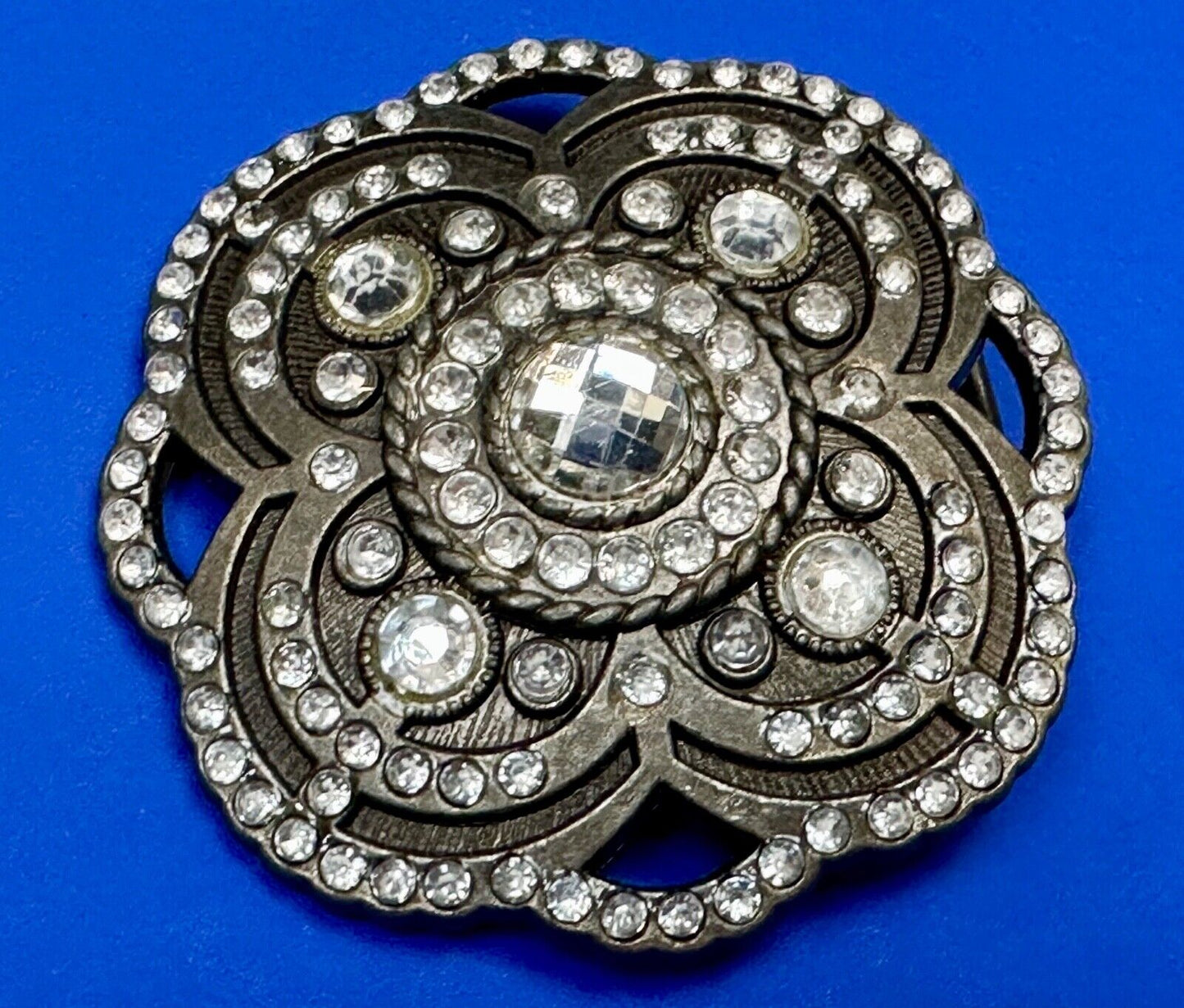 Beautiful Rhinestone accented see through flower shaped cutout belt buckle