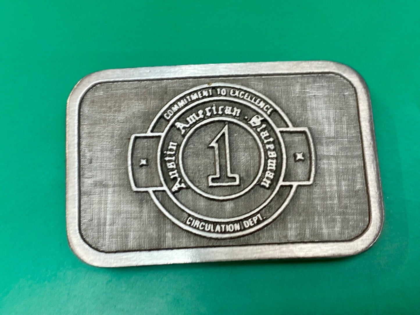 Asian American Circulation Dept Commitment to excellence belt buckle hit-line