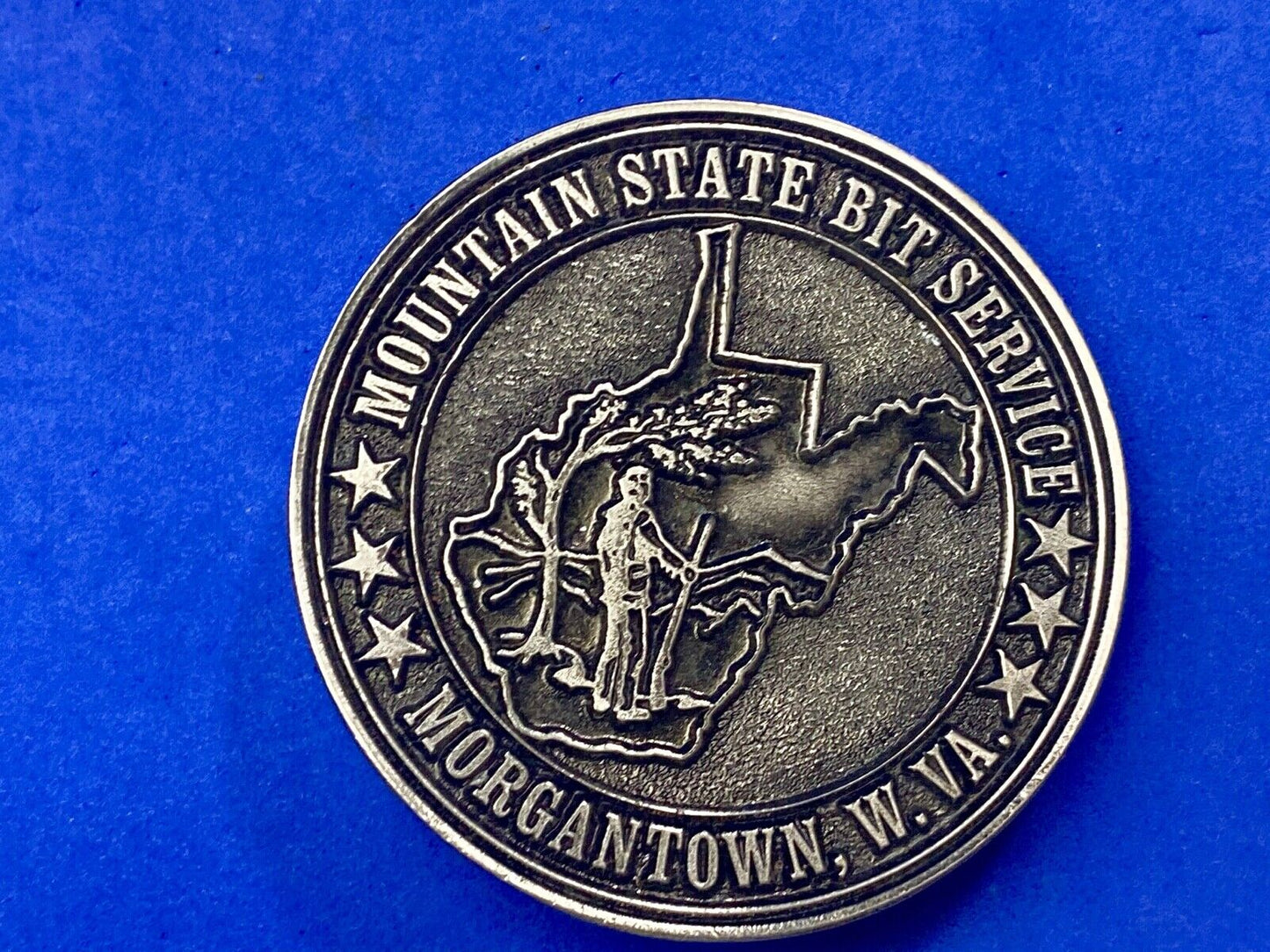 Vintage Mountain State Bit Services Morgantown W.V. round belt buckle by Lewis