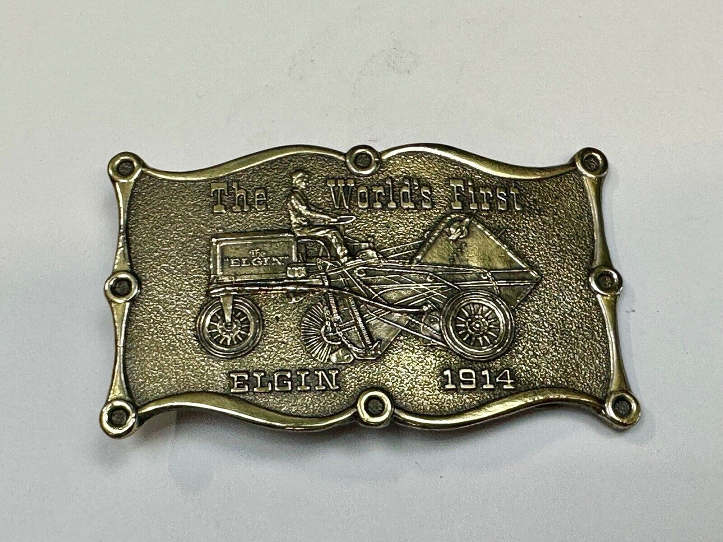 The Elgin, The worlds first tree sweeper commemorative belt buckle by Lewis