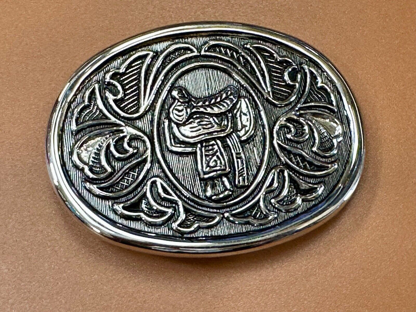 Vintage Cowboy's Horse Saddle ornate flower swirl oval belt buckle by Avon