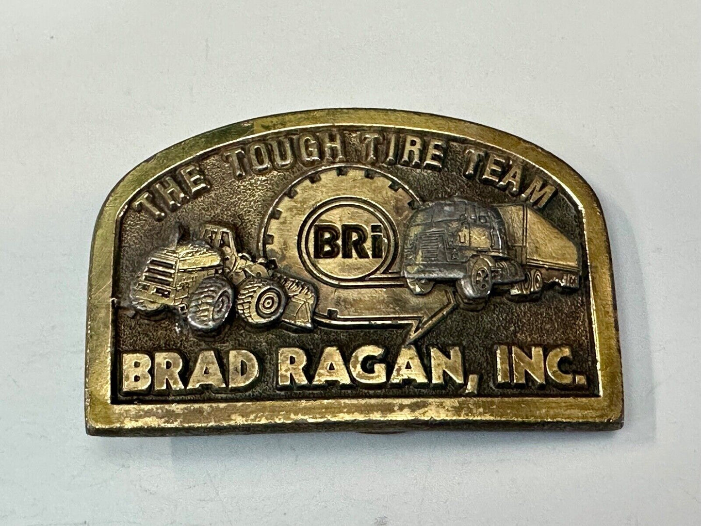 The Tough Tire Team BRi Brad Ragan, Inc. vintage belt buckle by Spec-Cast