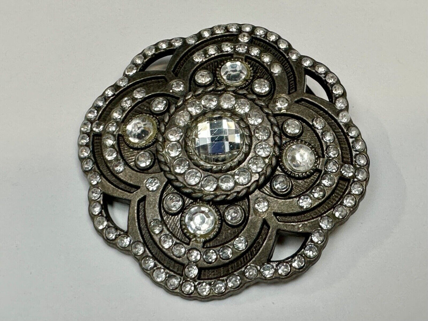 Beautiful Rhinestone accented see through flower shaped cutout belt buckle