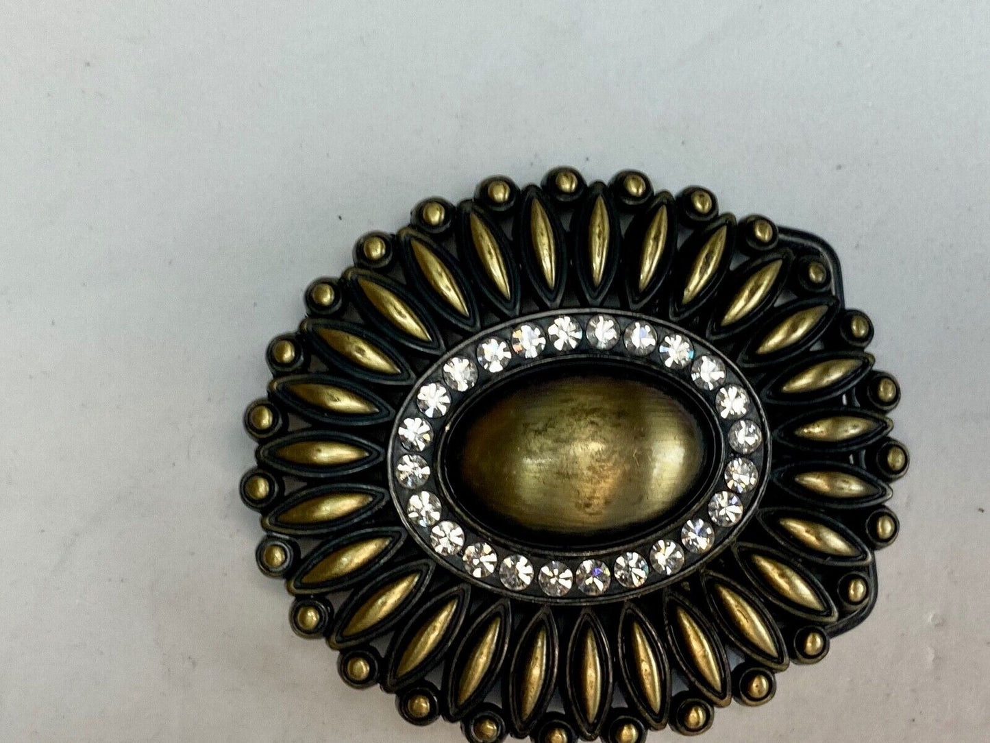 Beautiful southwest vibe layered belt buckle with ring of rhinestones