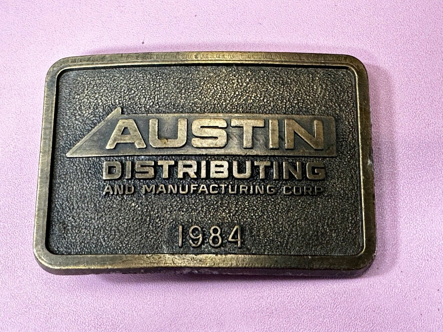 Austin Texas Distributing and Manufacturing 1984 Advertisement Promo Belt Buckle