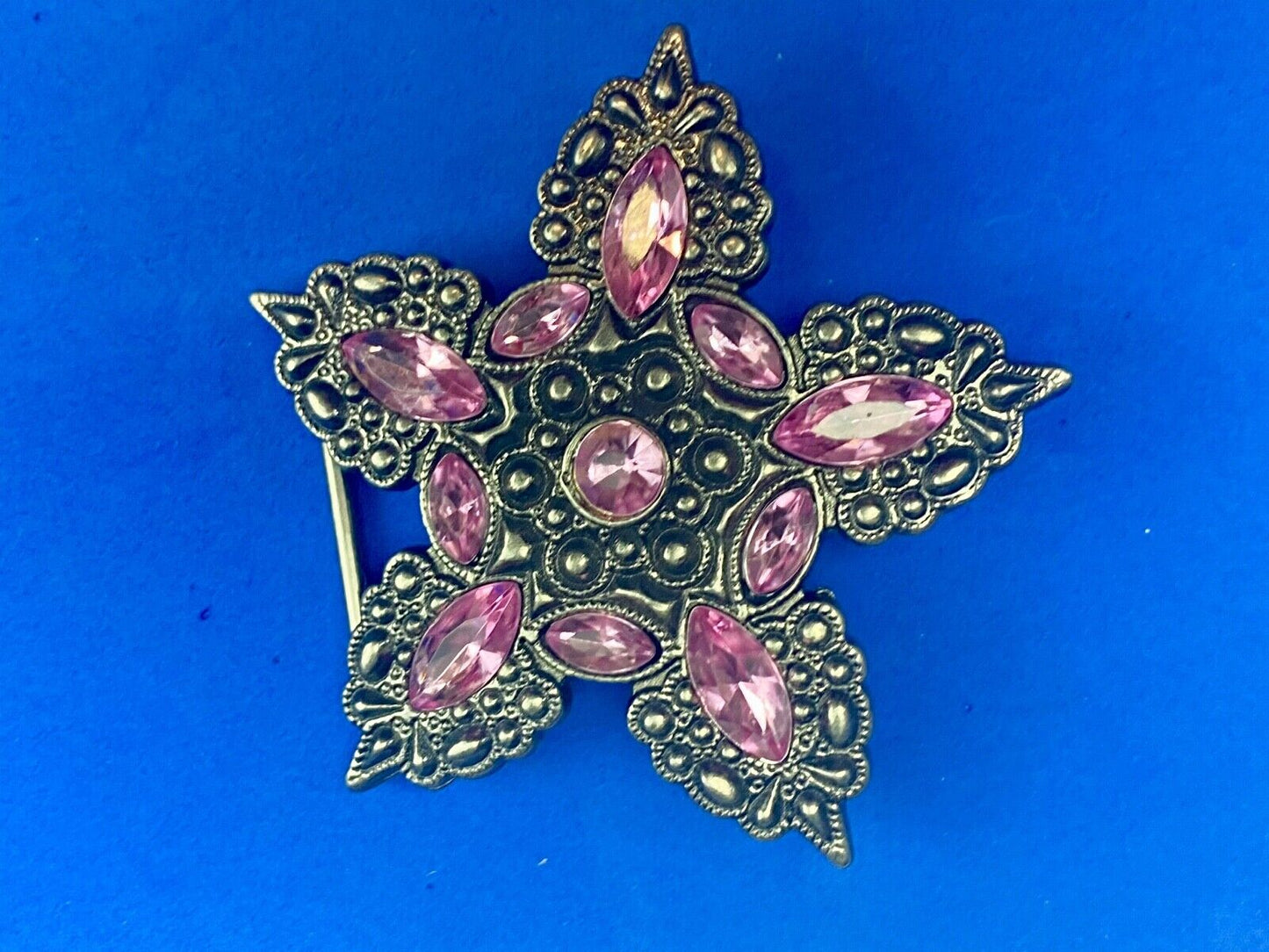 Beautiful figural star with pink accent rhinestones