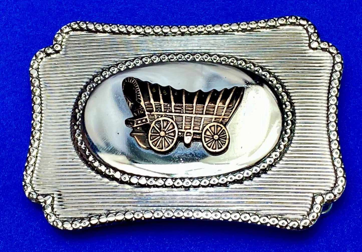 Vintage Covered wagon two tone reflective pre loved, western framed belt buckle
