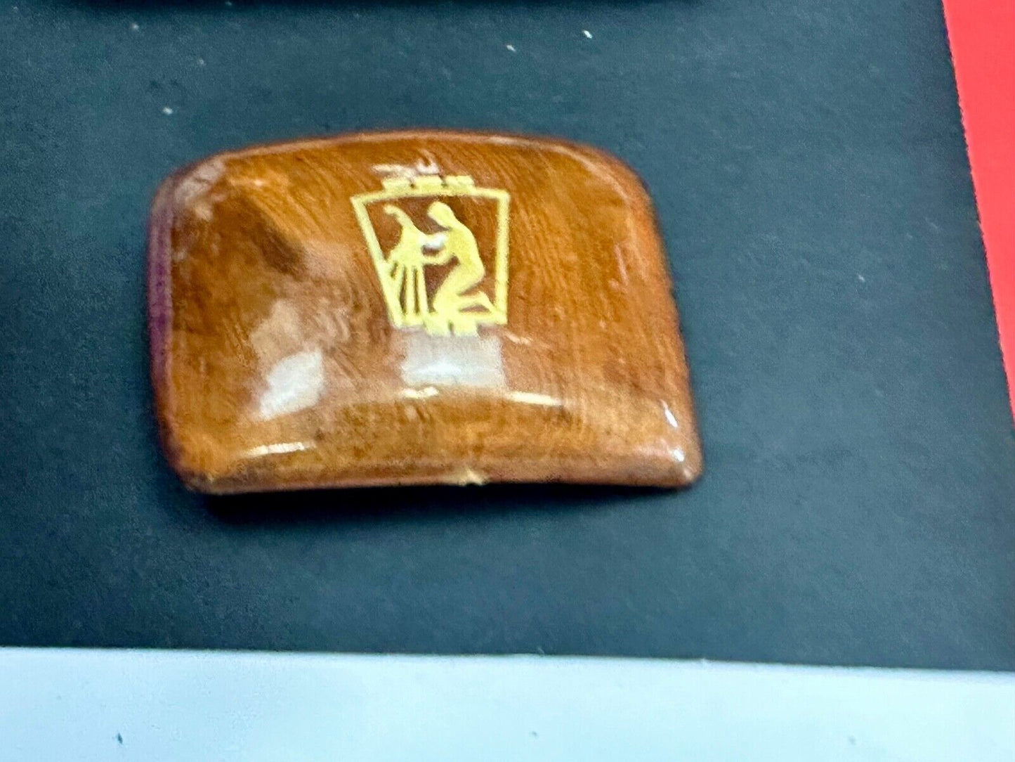 Artisan wooden glossy wood belt buckle with gold color artist scene?