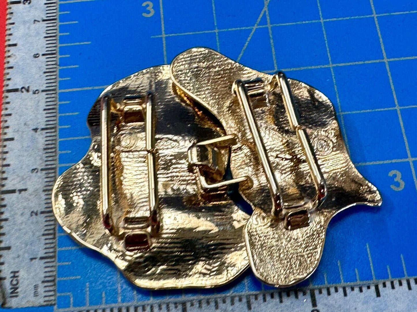 Two-piece interlocking gold tone leaf swirl theme belt slide buckle signed _____