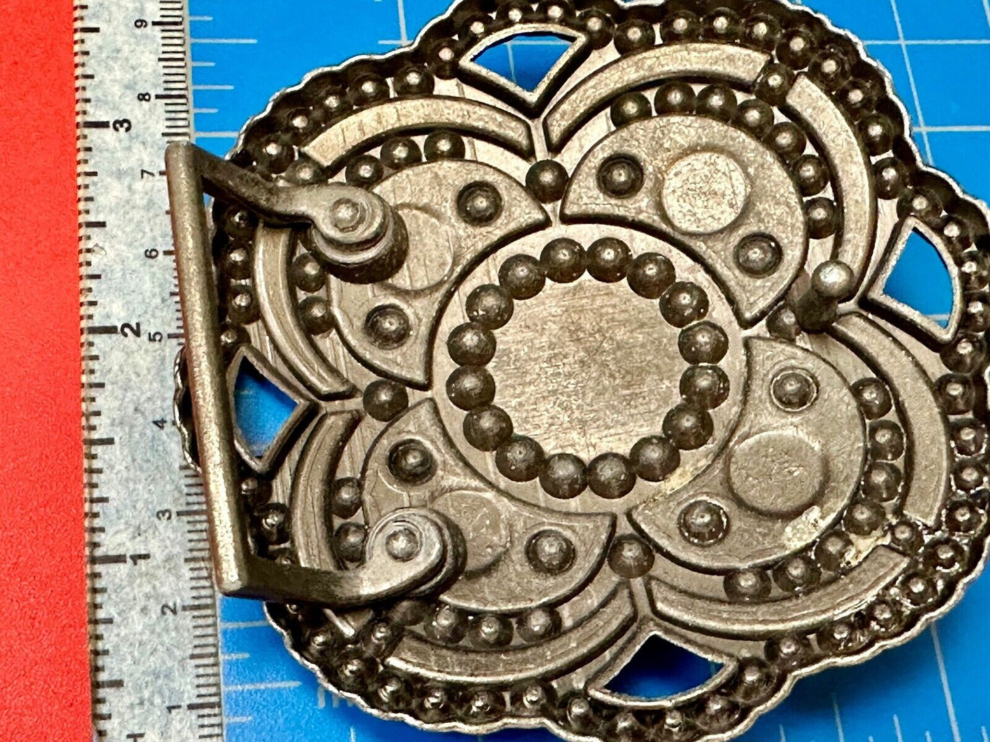 Beautiful Rhinestone accented see through flower shaped cutout belt buckle