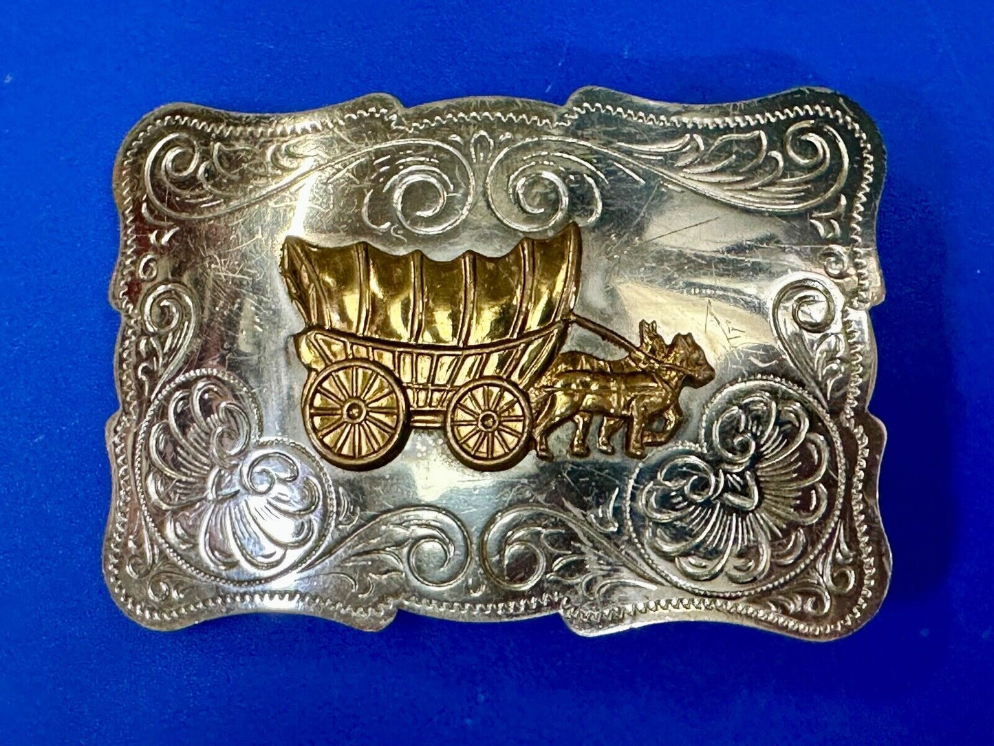 Vintage Covered Wagon two tone ornate cowboys out west flower swirl belt buckle