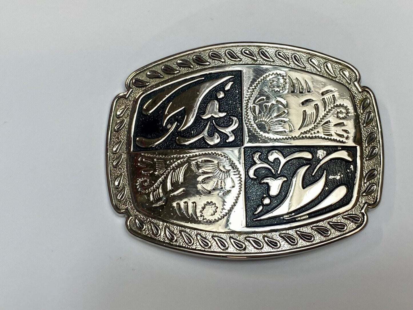black and silver color western flower swirl outlined cowboy's belt buckle