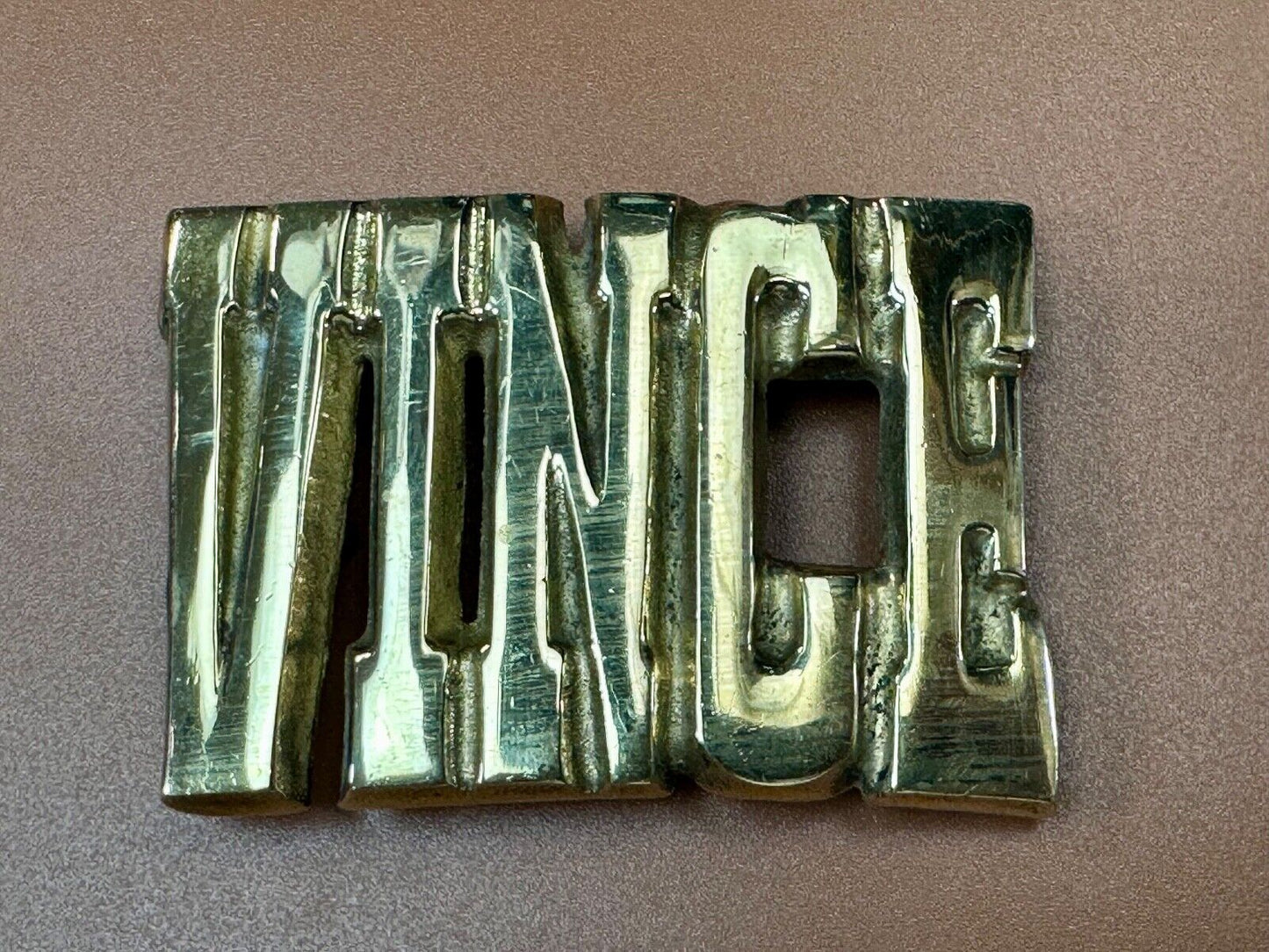 Vince, Cutout block letters solid brass Vintage belt buckle marked Taiwan ROC