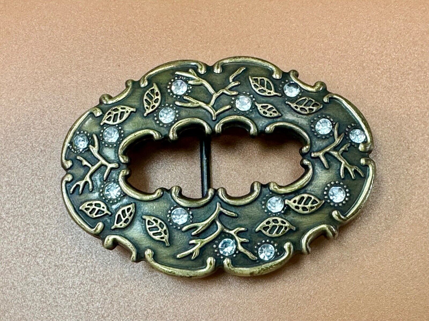 3" wide brown rhinestone accented leaf pattern semi oval belt buckle