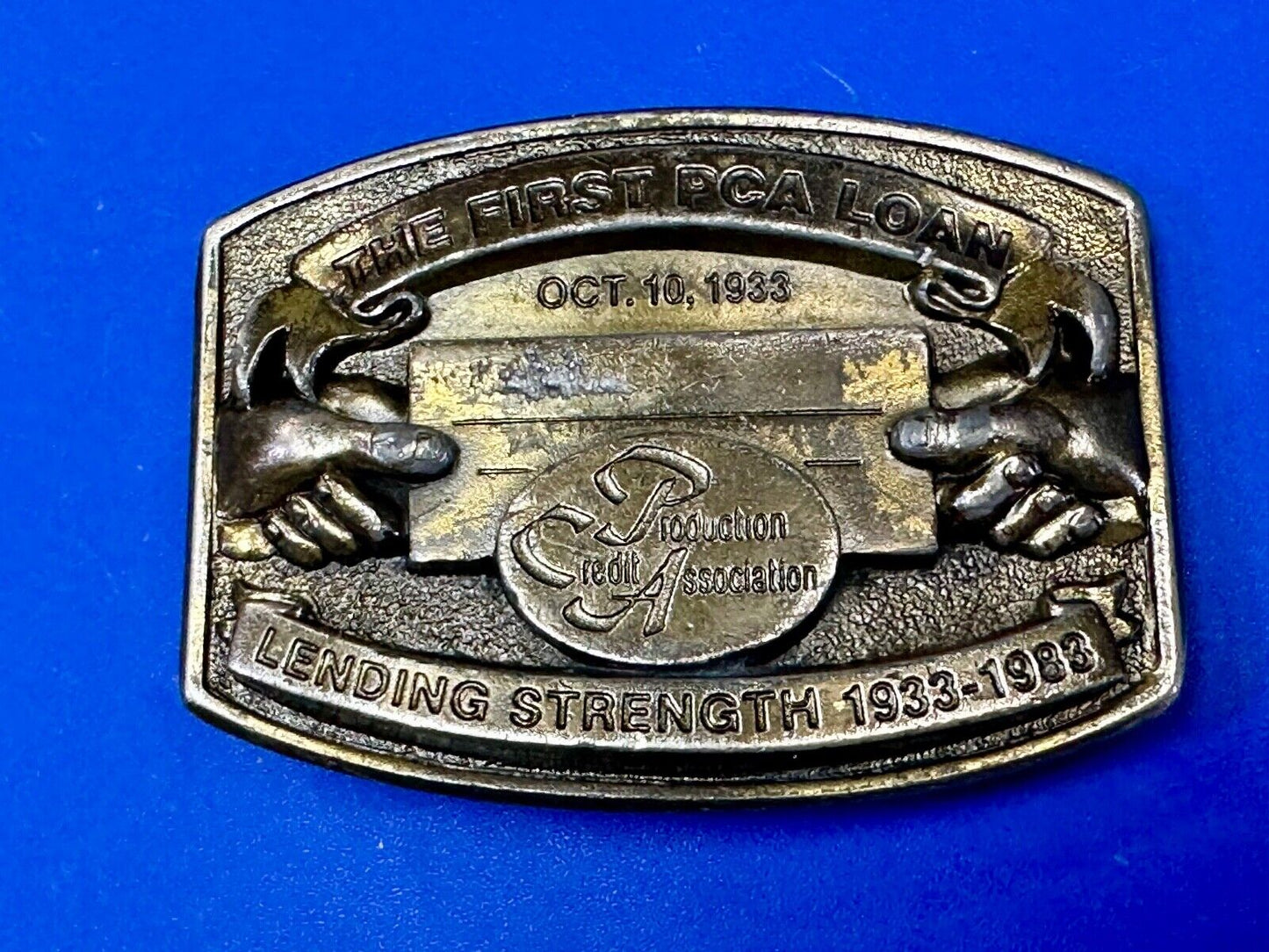 The First PCA loan Production Credit - Vintage The Great American Belt Buckle Co