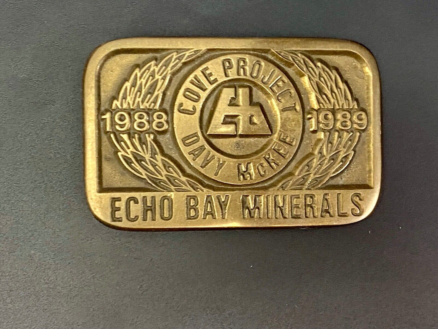 Vintage 1989 **ECHO BAY MINERALS** COVE PROJECT MINING SOLID BRASS BUCKLE