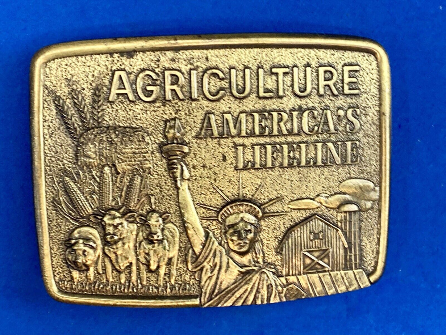AGRICULTURE, Americas Lifeline belt buckle by Farmhand Statue of liberty
