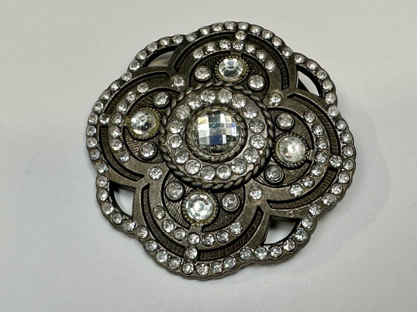Beautiful Rhinestone accented see through flower shaped cutout belt buckle