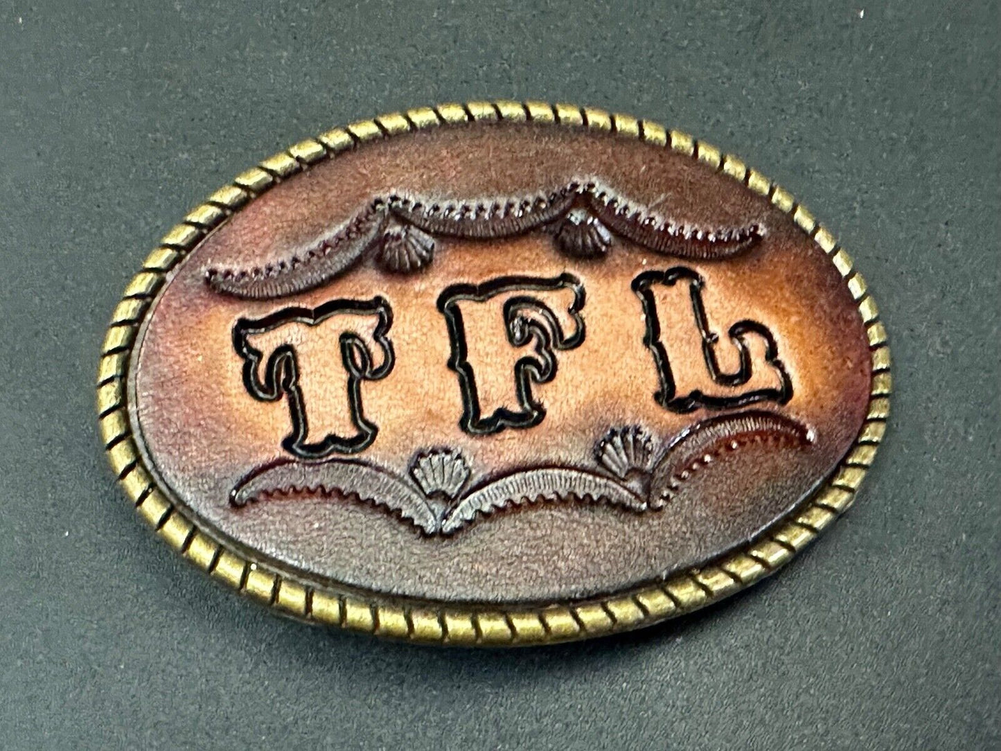 TFL. vintage western initials letters on leather belt buckle