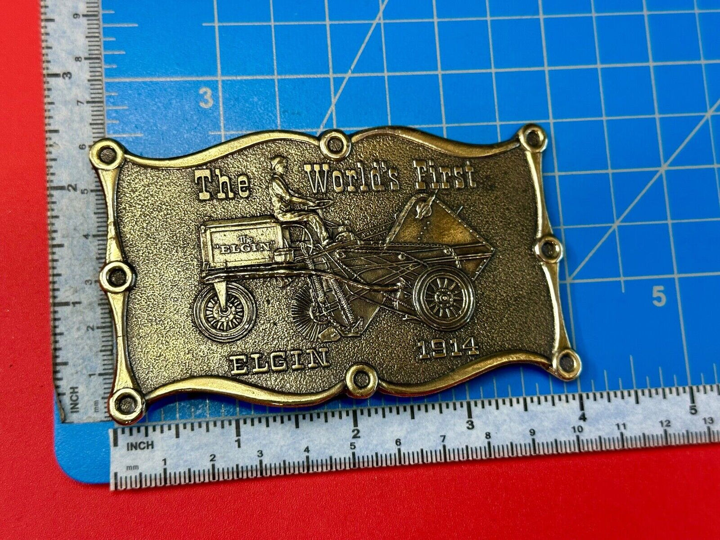 The Elgin, The worlds first tree sweeper commemorative belt buckle by Lewis