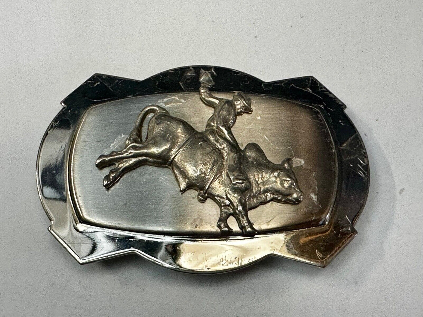 Vintage Cowboy Saddle Bronc on reflective two tone western belt buckle