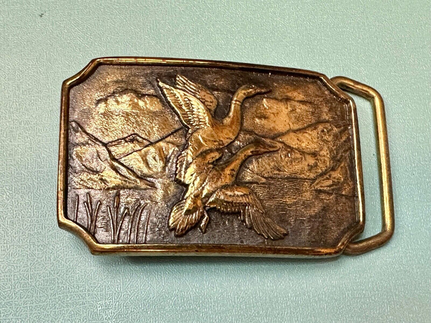 Two ducks flying from pond cat tails Nature Solid Brass belt buckle by BTS