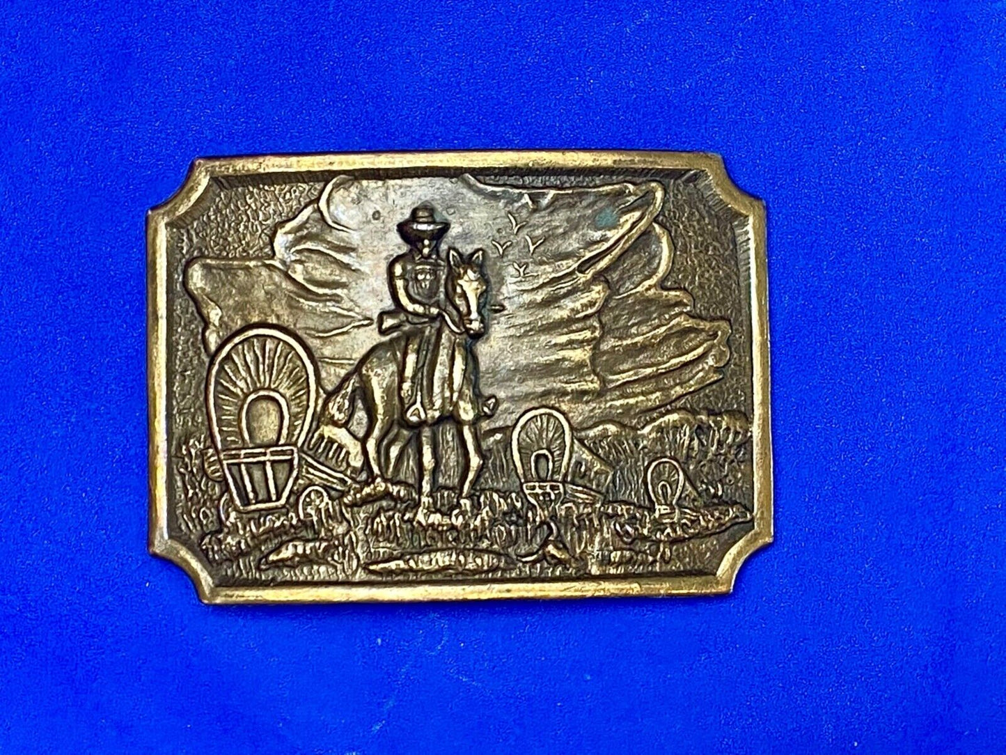 Tall in the Saddle - Covered Wagon Cowboy brass tone western belt buckle
