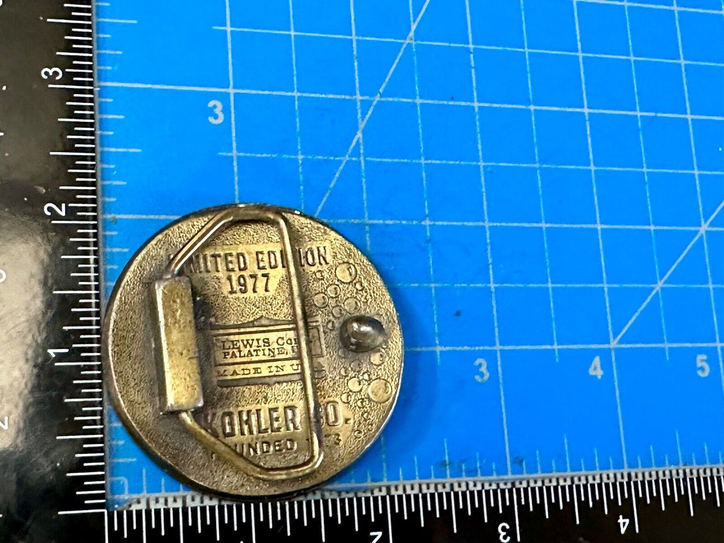 The Bold Look of Kohler Vintage 1977 Lewis round Limited Edition belt buckle