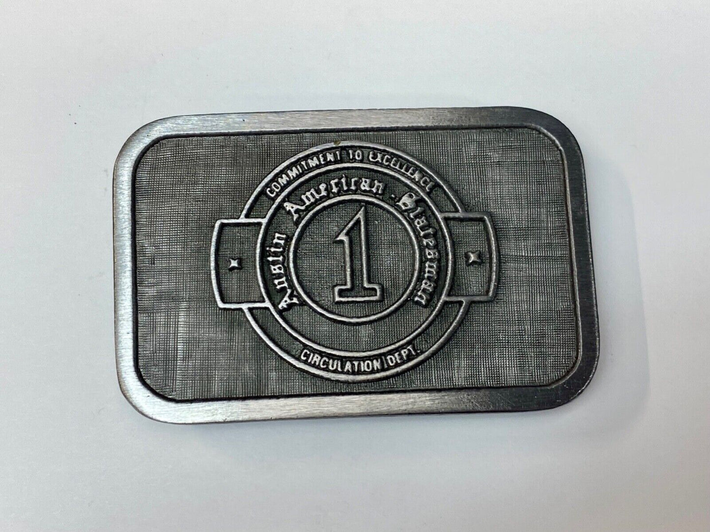 Asian American Circulation Dept Commitment to excellence belt buckle hit-line