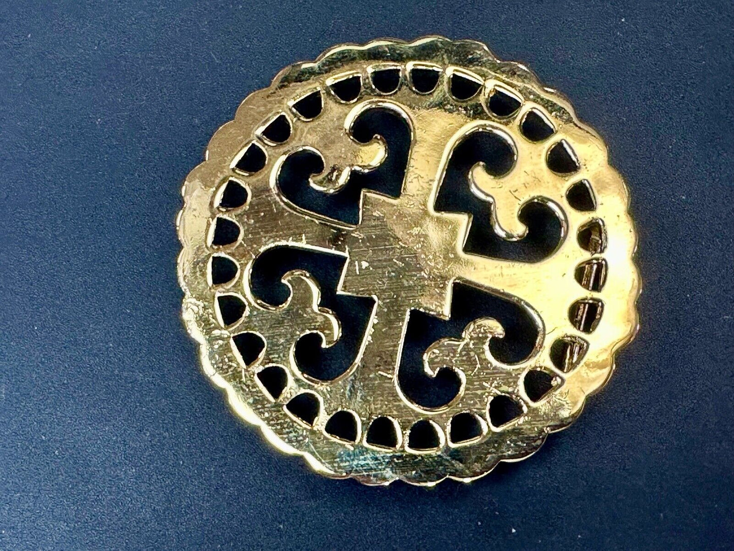 vintage Celtic pattern round cutout belt buckle by designer Ann Lansing