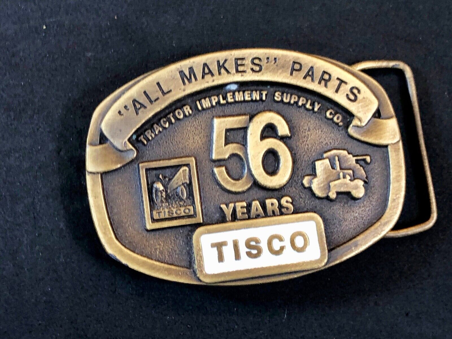 TISCO - 56 years tractor farming parts supply store advertising belt buckle