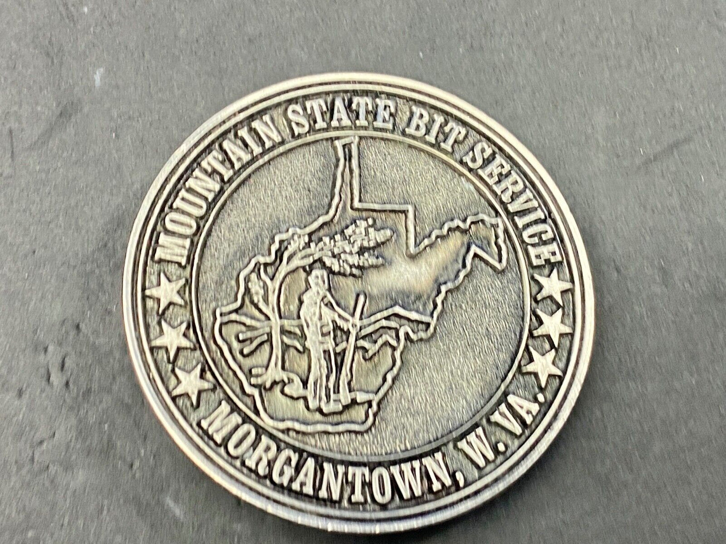Vintage Mountain State Bit Services Morgantown W.V. round belt buckle by Lewis