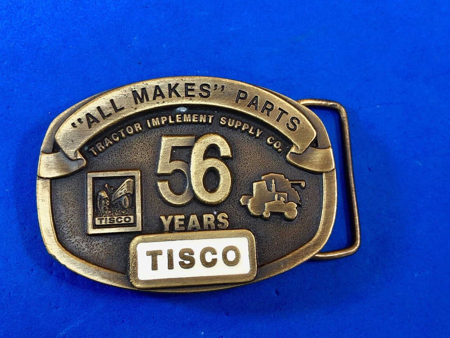 TISCO - 56 years tractor farming parts supply store advertising belt buckle