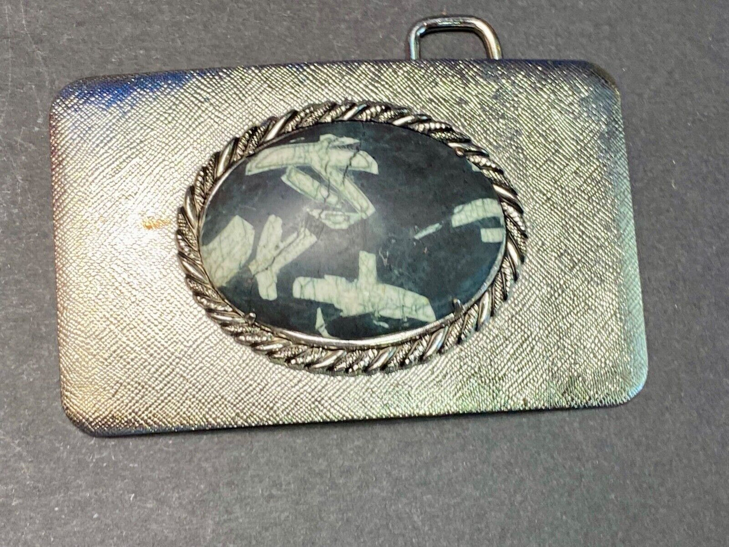 Black & white Oval Cabochon Conch centerpiece on Western belt buckle