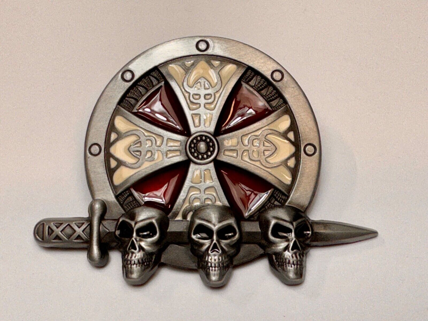 Three skulls with sword through heads on Iron Cross round NOS belt buckle
