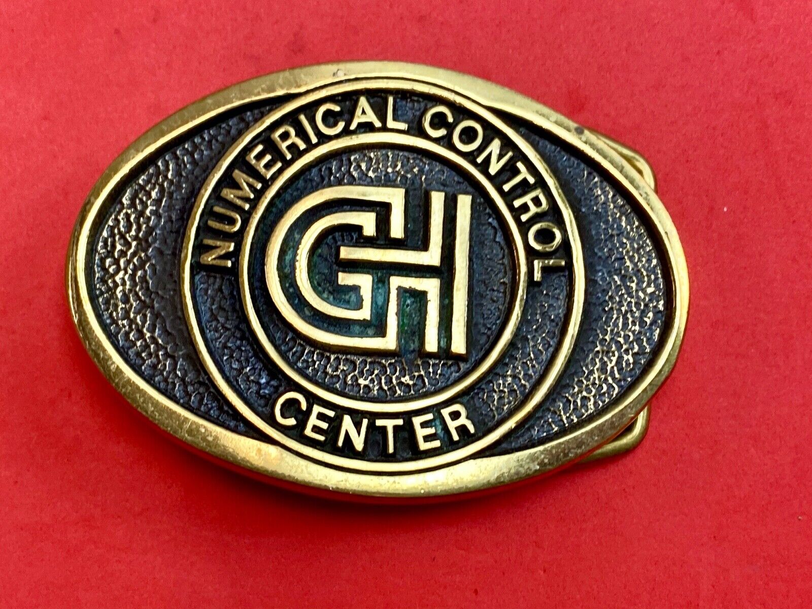 Vintage GH Numerical Control Center solid brass belt buckle by Blue Bayou 