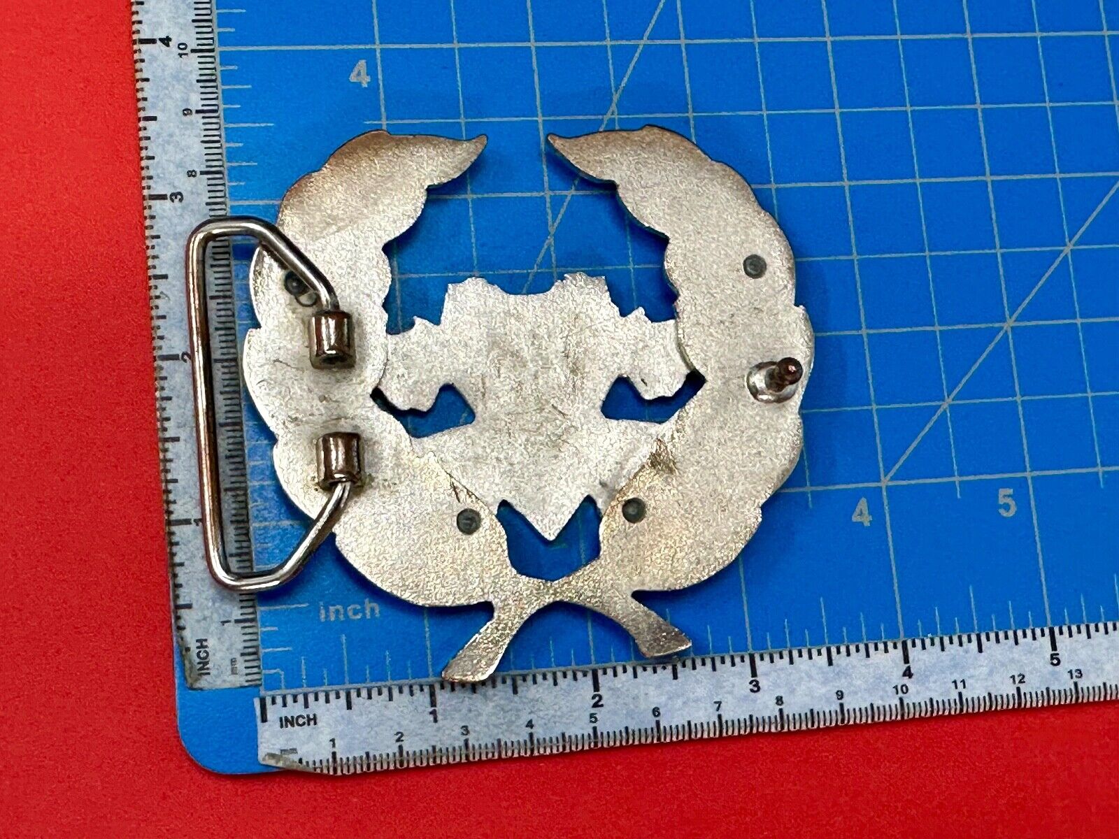 Two griffins?  FME RheJNG Olive branch cutout belt buckle