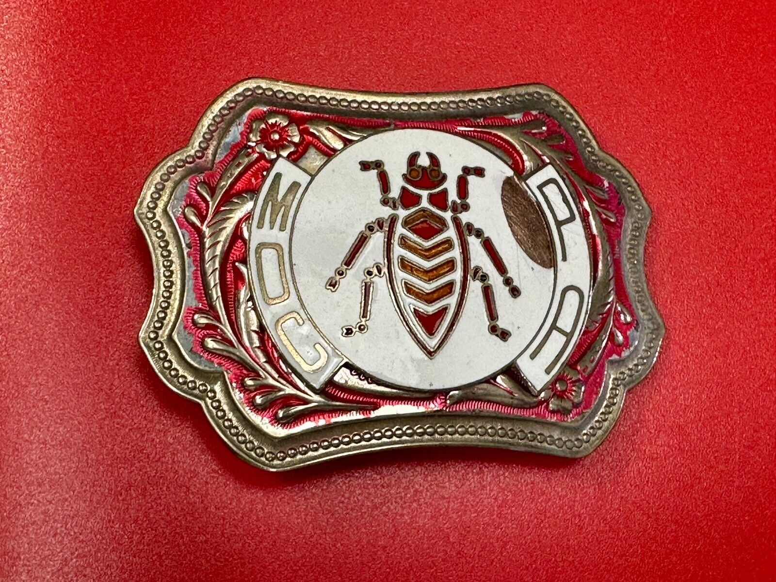 unique insect bug centerpiece on western red & white flower swirl belt buckle