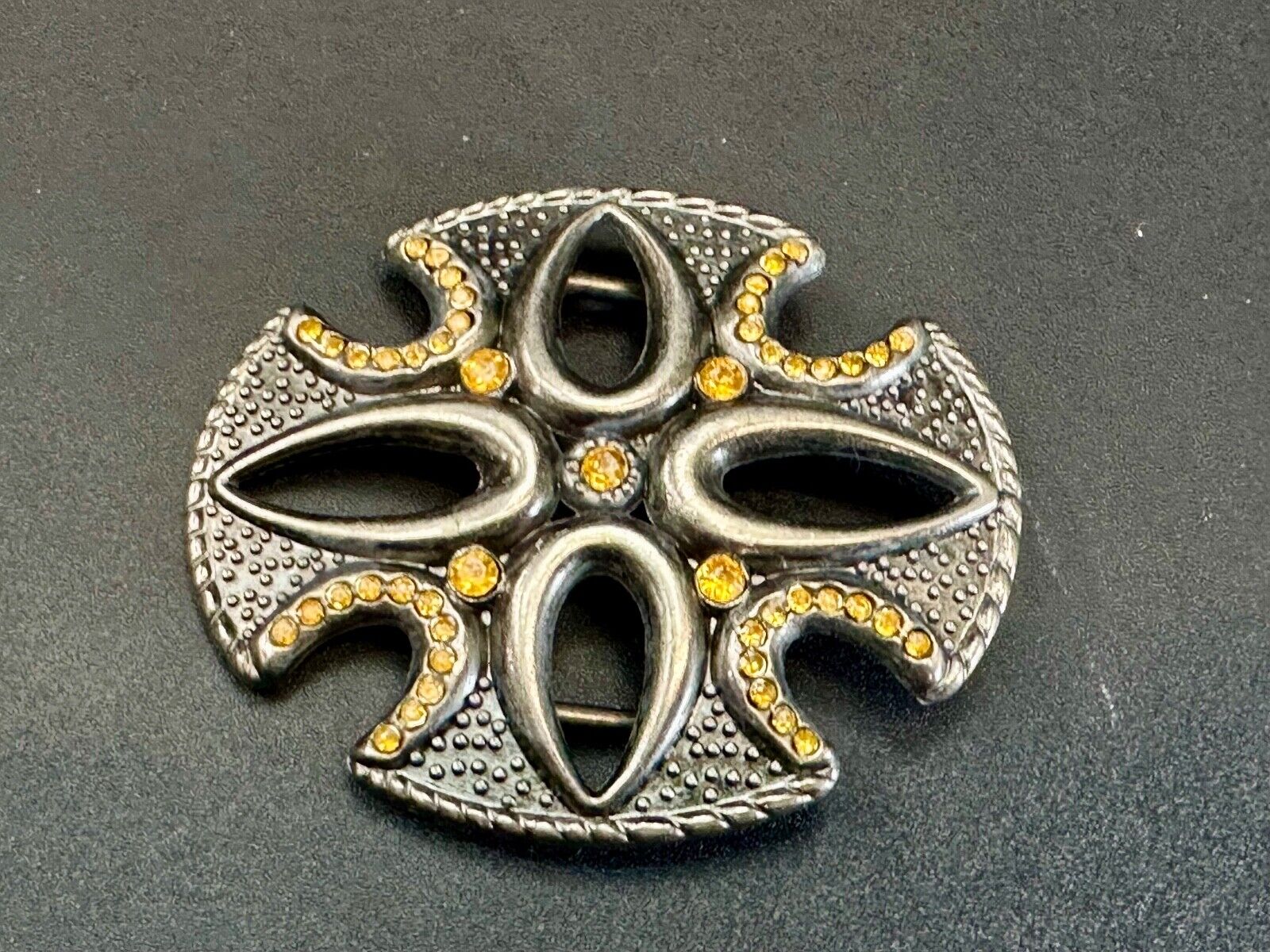 unique see through iron cross with golden brown rhinestone accents