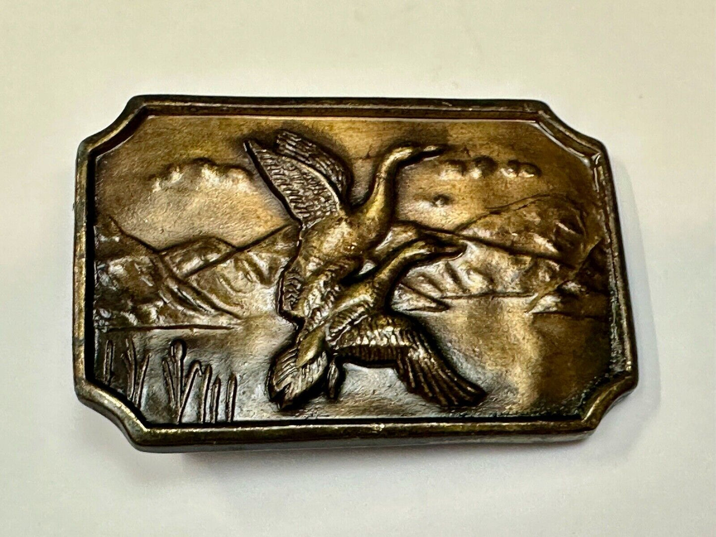 Two ducks flying from pond - Vintage nature scene belt buckle