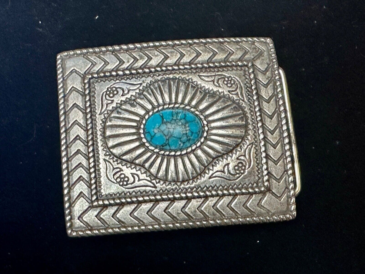 Turquoise Cab centerpiece on southwestern pattern silver tone belt buckle