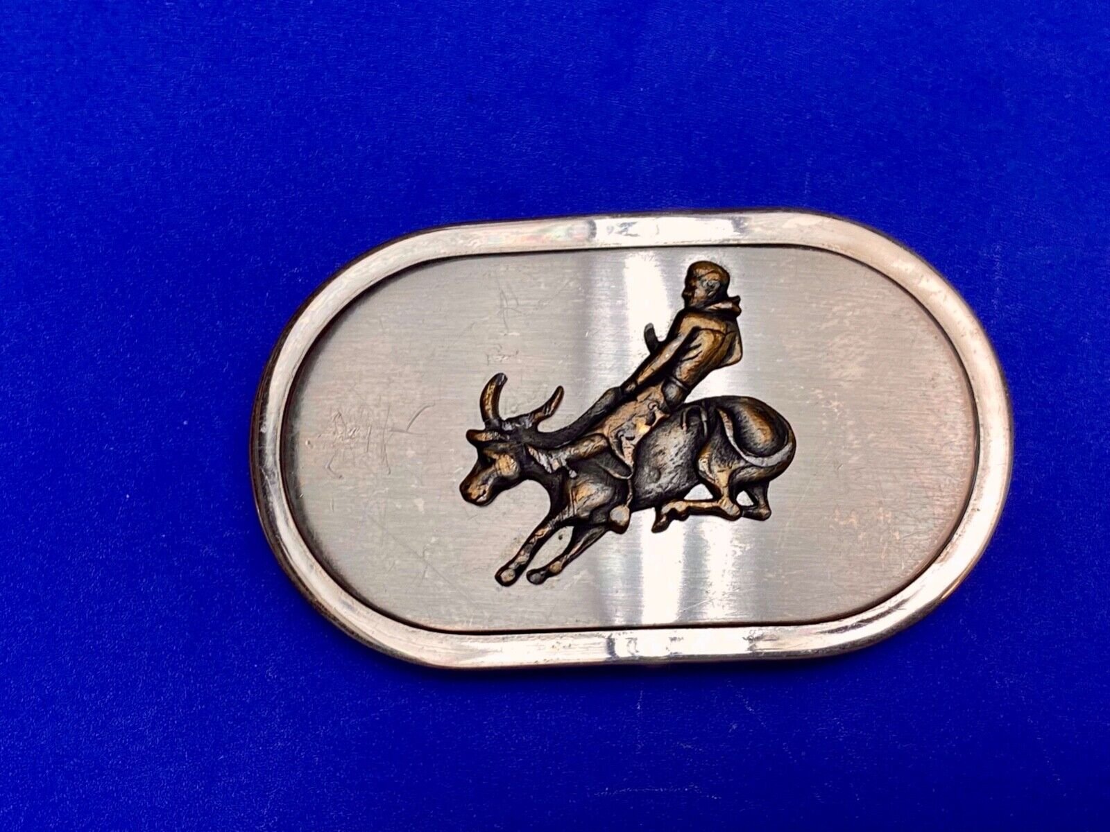 Vintage western oval Rodeo Cowboy on bucking bronc? bull numbered belt buckle