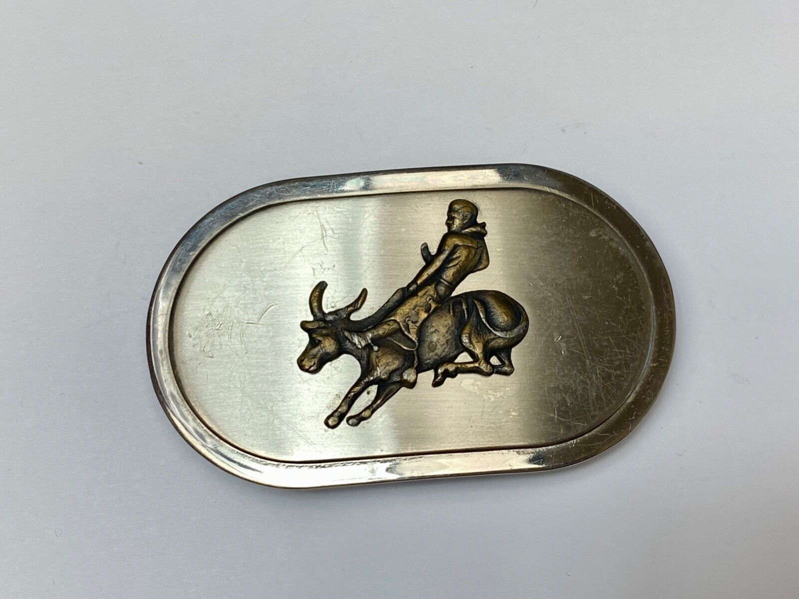 Vintage western oval Rodeo Cowboy on bucking bronc? bull numbered belt buckle