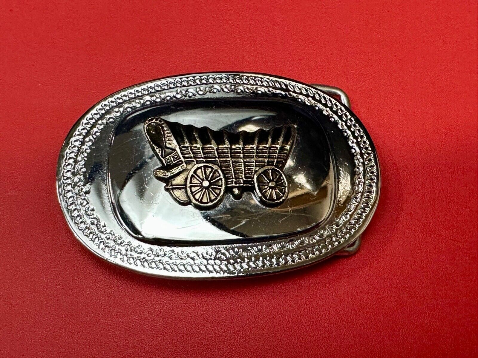 Vintage Covered Wagon on reflective oval two tone western belt buckle