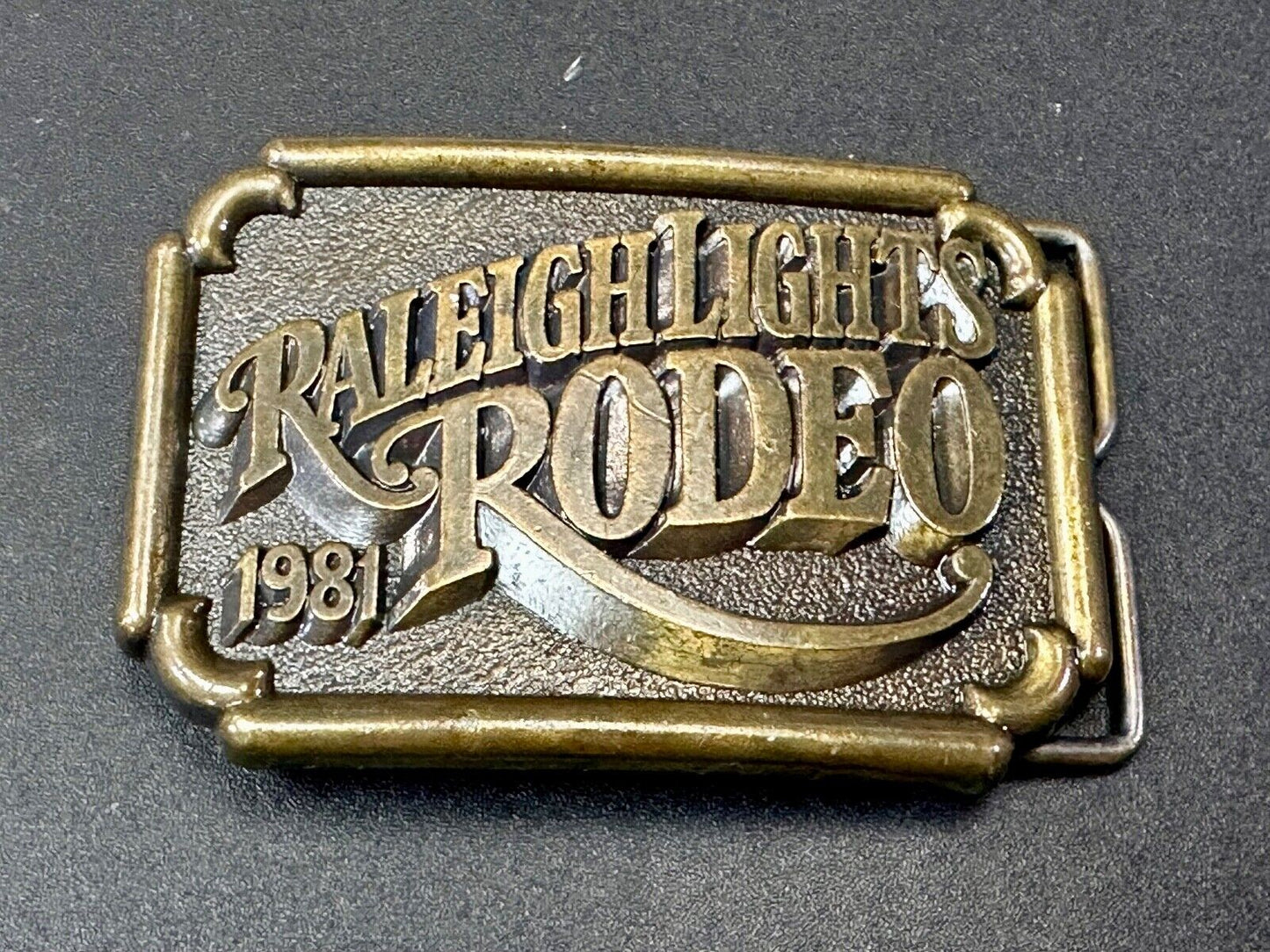 Vintage 1981 RALEIGH LIGHTS RODEO CIGARETTES SPONSOR Brass tone belt buckle