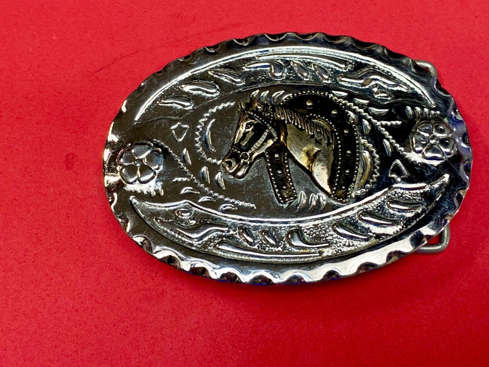 Vintage horse head through lucky horseshoe on mixed metal western belt buckle